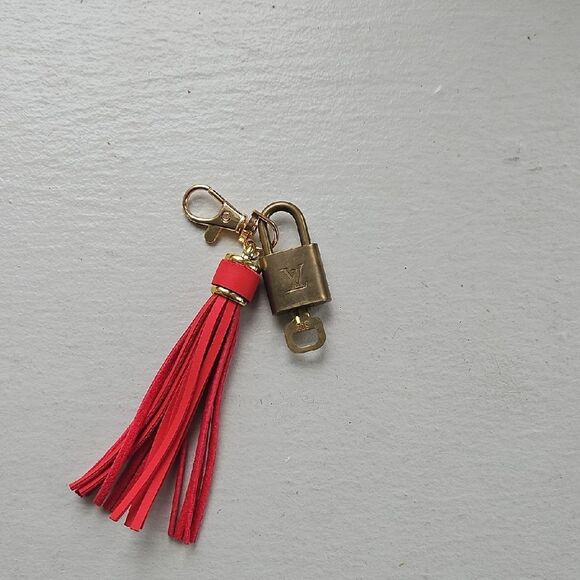 LOUIS VUITTON Red Tassel Keychain with Gold Accents - Picture 3 of 4